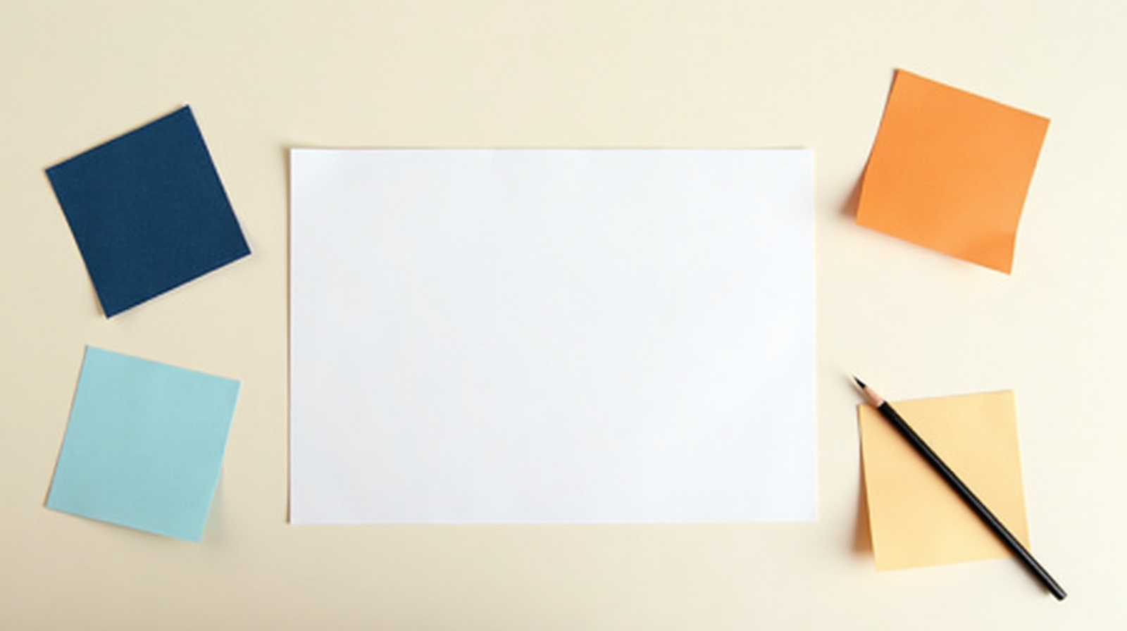 Desk with organized notes, logo files, and business information gathered before starting a website